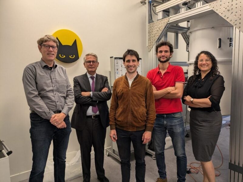 Group of engineers and executives in laboratory